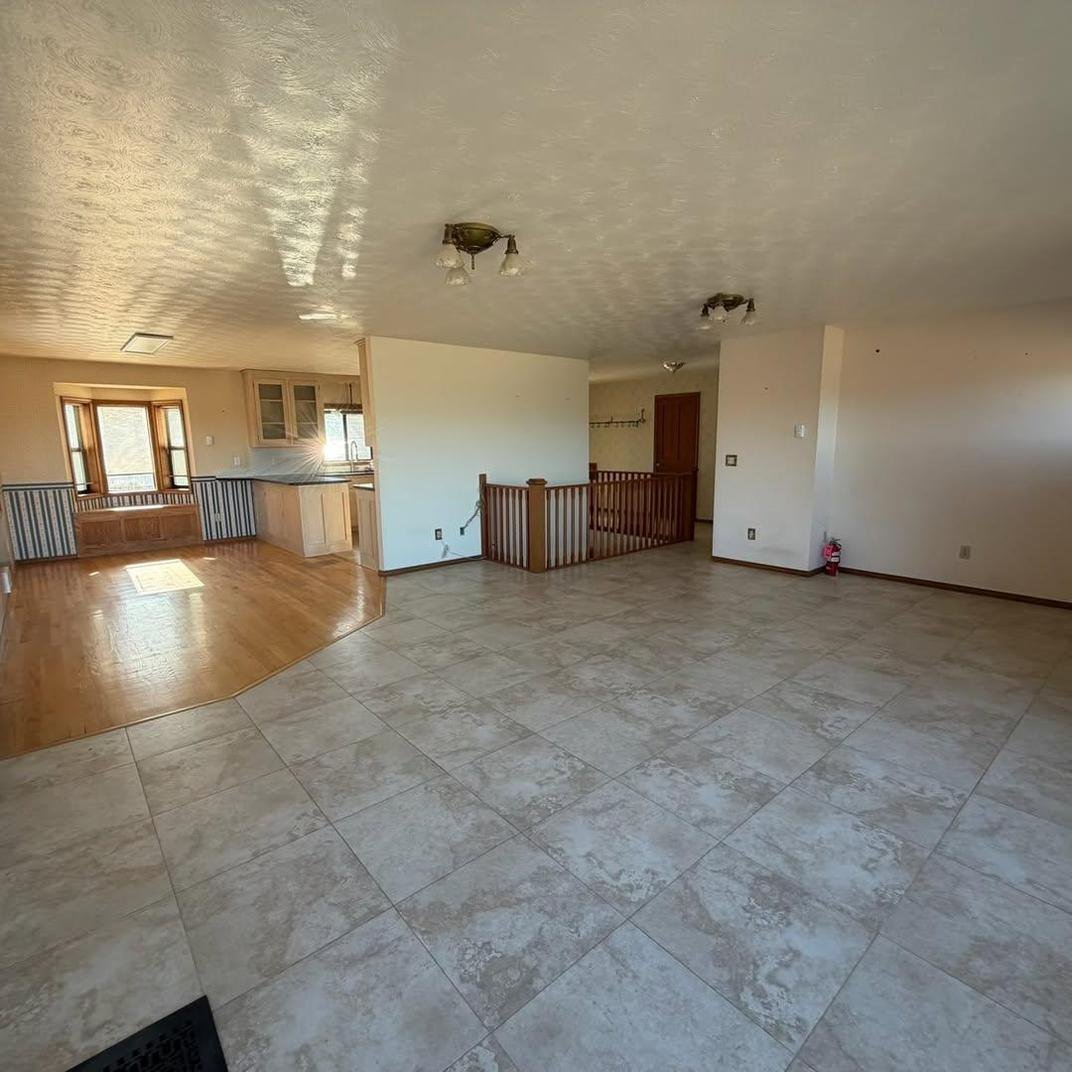 Open living space cleared and prepped for new flooring
