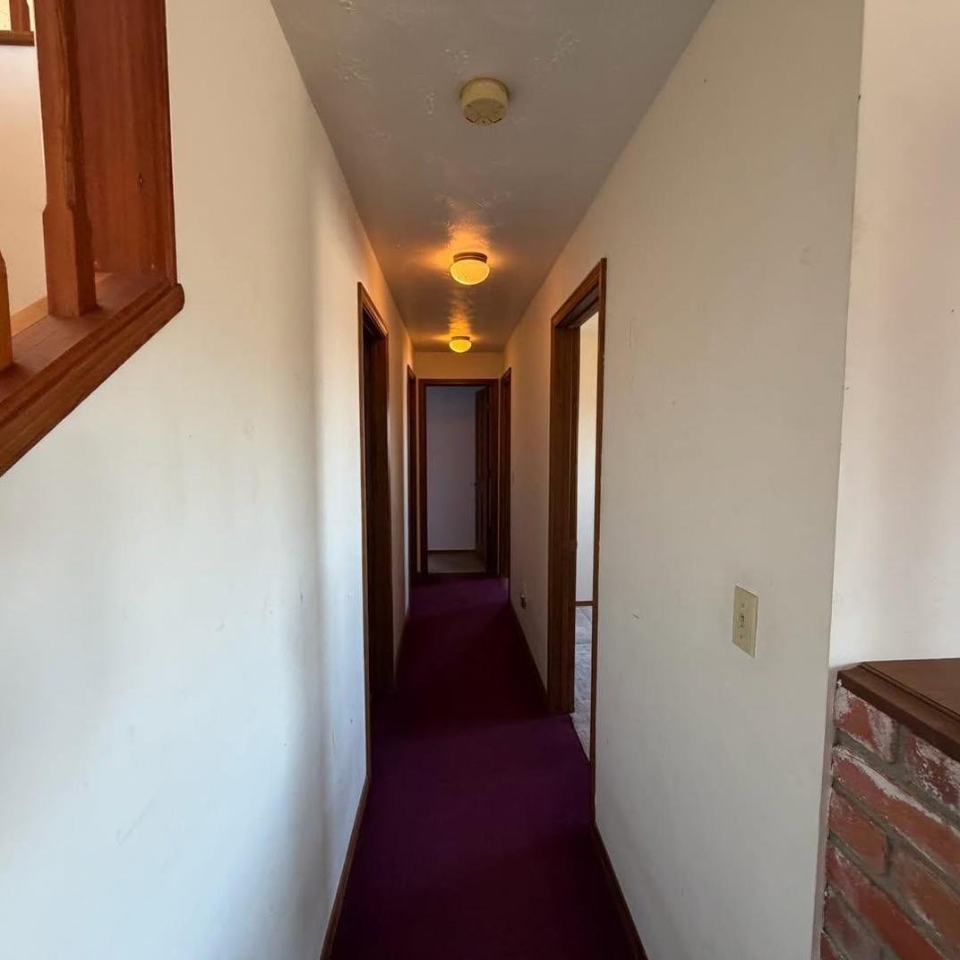 Hallway with original carpet before replacement