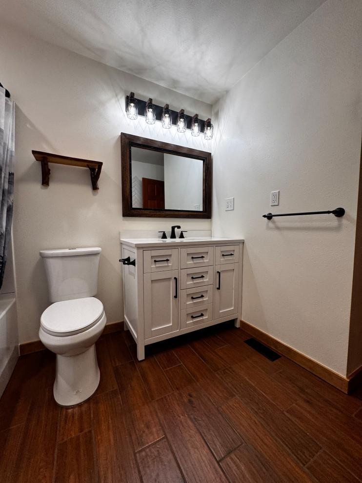 Finished vanity with framed mirror and black hardware