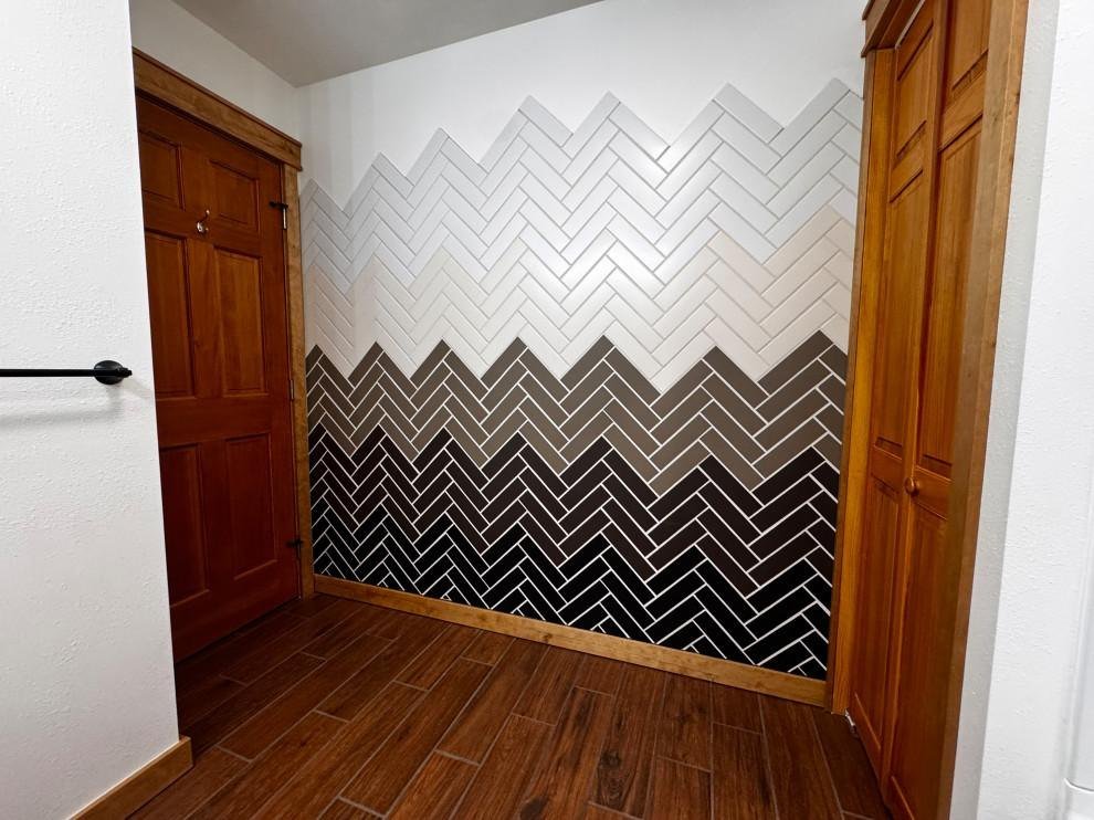 Herringbone tile accent wall installed during a remodel